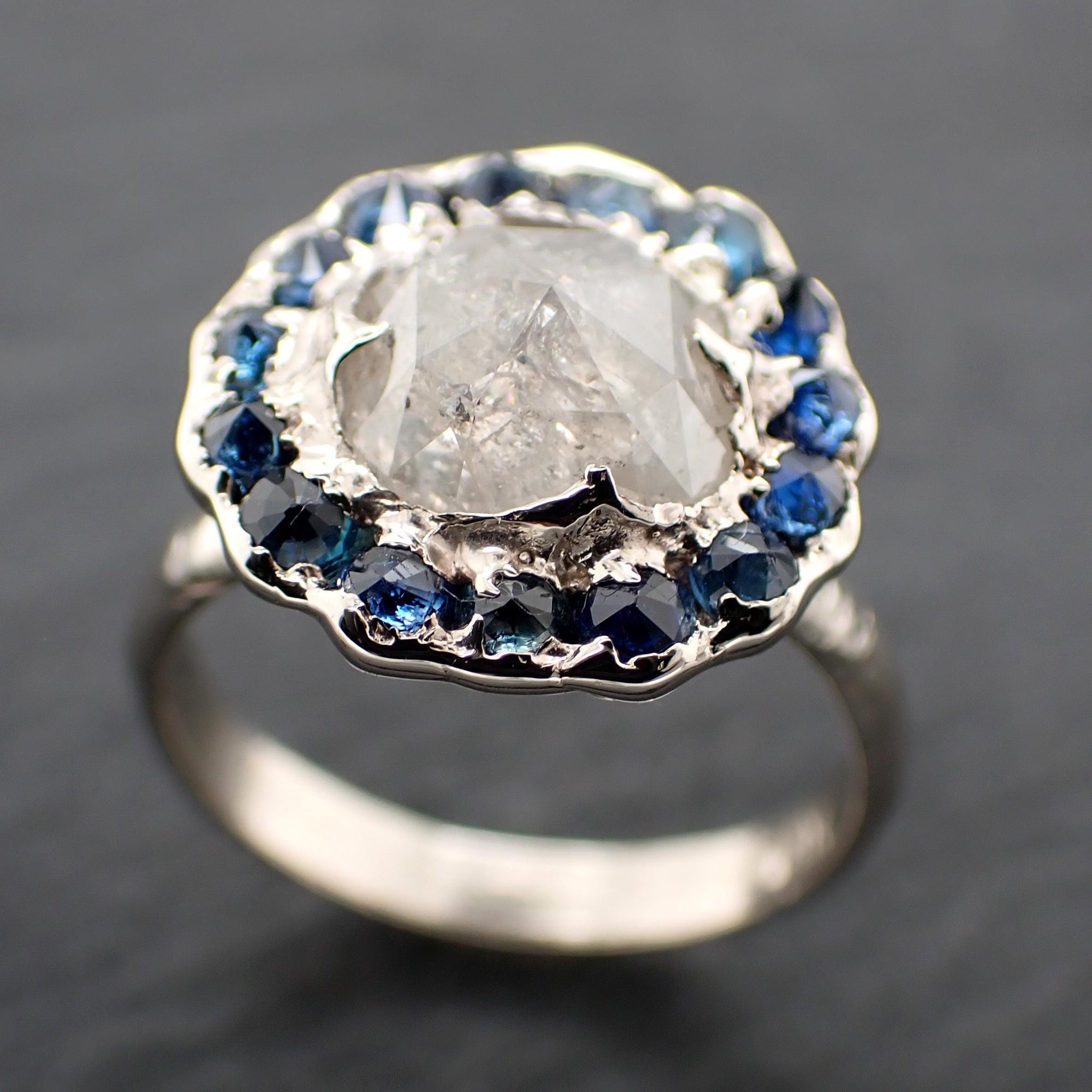 Handcrafted 14k white gold engagement ring.A 2.145 ct diamond with sapphire halo. A timeless peice of wedding elegance.A statement ring!3582